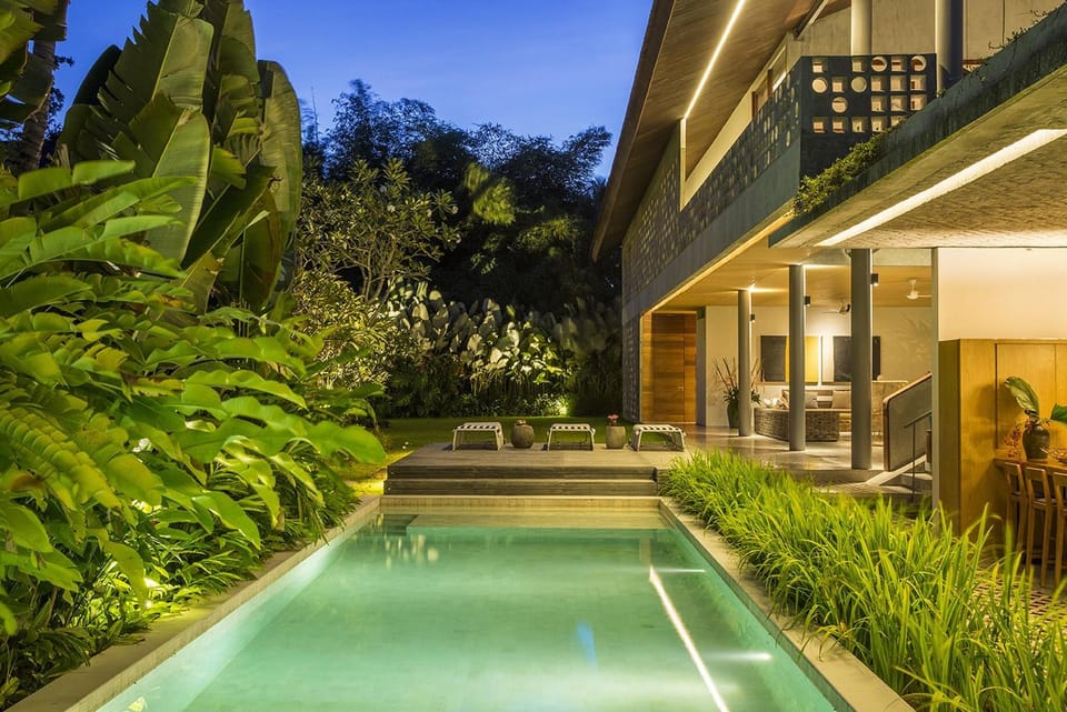 Property building, Patio, Night, Garden, Swimming pool, sunbed