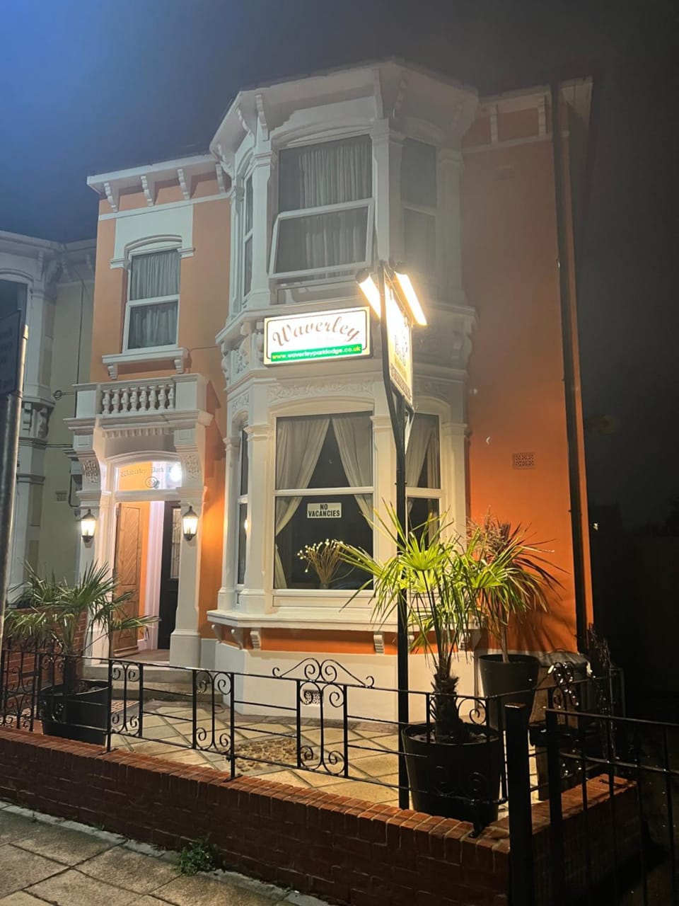 Property building, Facade/entrance, Night, Property logo or sign, Seating area