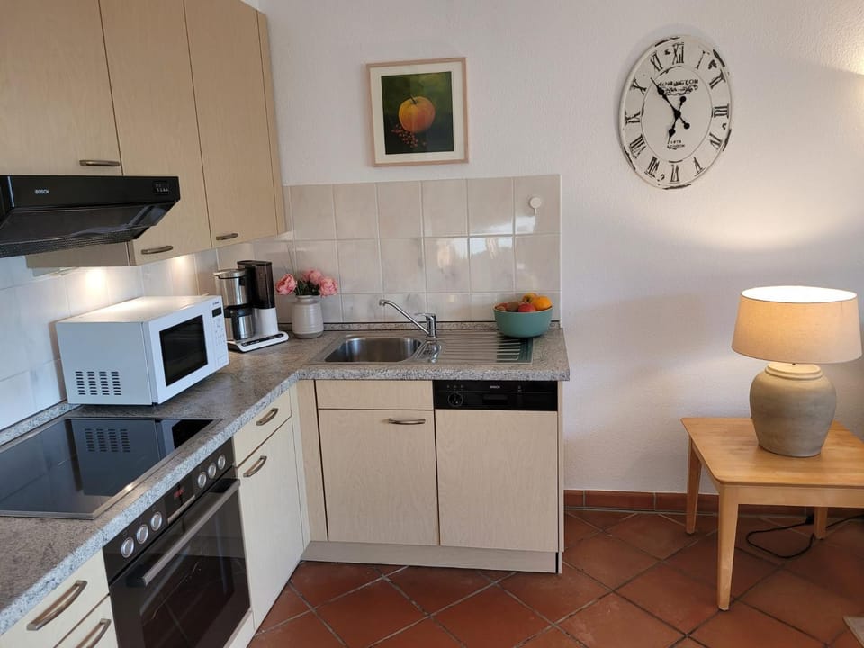 Kitchen or kitchenette, microwave, stove, stove