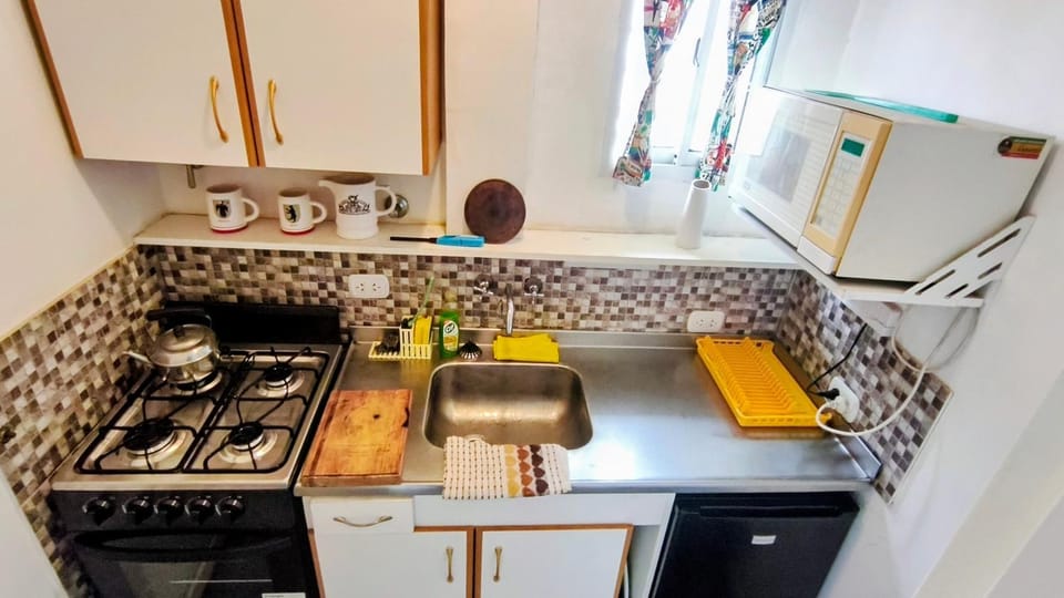 Kitchen or kitchenette, oven, stove