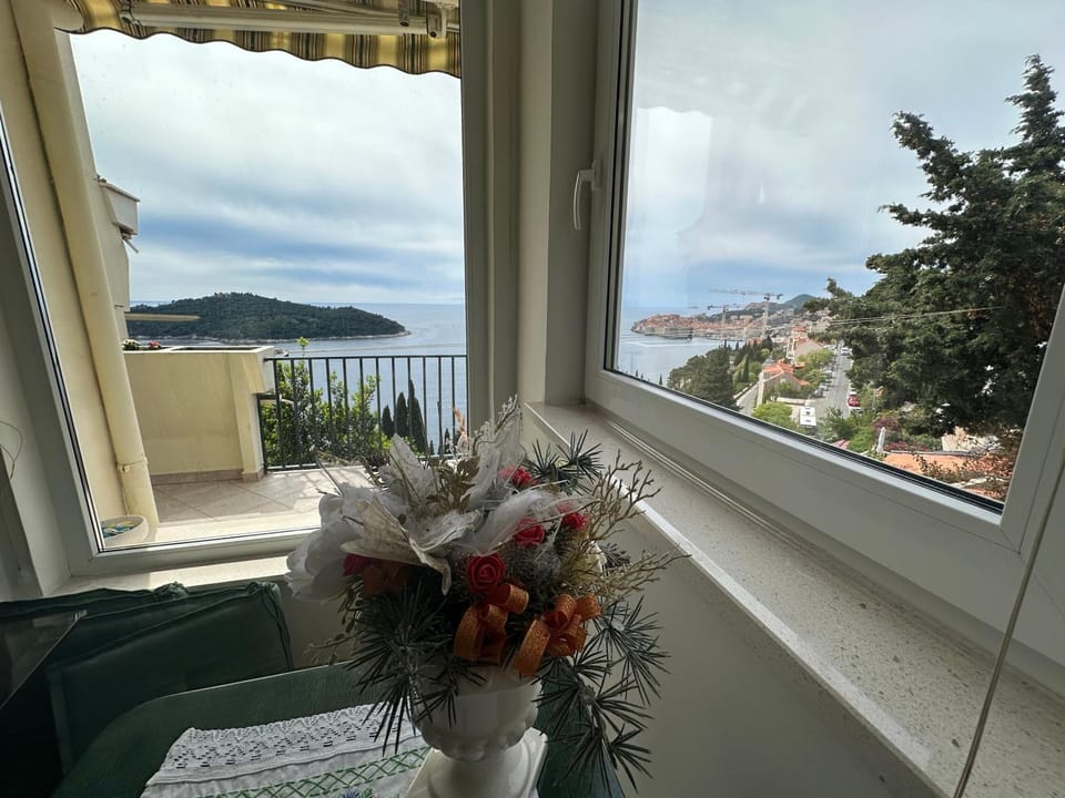 Natural landscape, View (from property/room), Living room, Seating area, Sea view