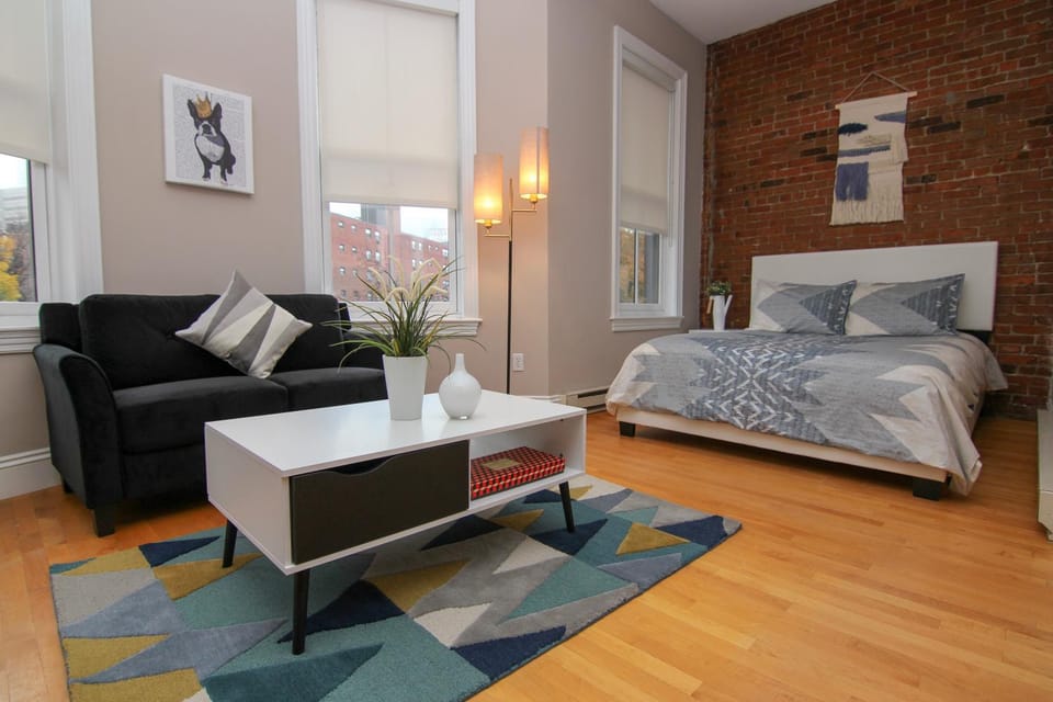 Bed, Living room, Seating area, Bedroom, City view