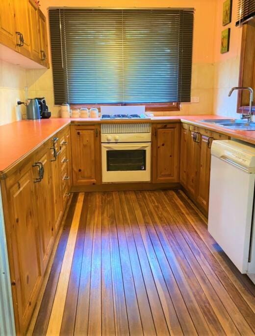 Kitchen or kitchenette, dishwasher, microwave, oven, stove