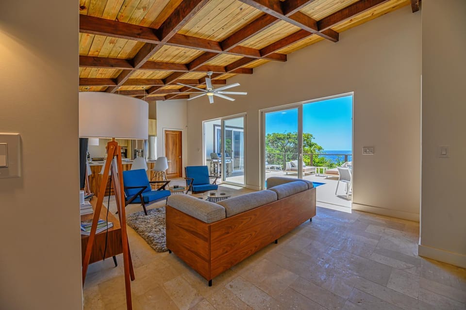Patio, Living room, Seating area, Sea view, Swimming pool
