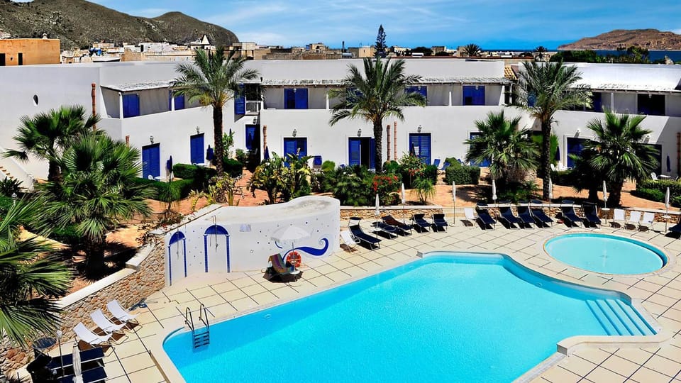 Property building, Natural landscape, Pool view, Swimming pool, sunbed