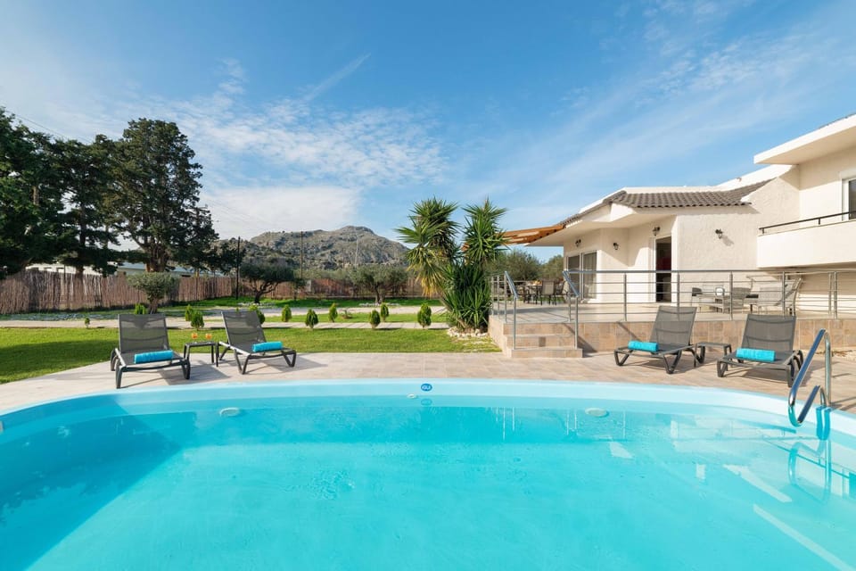 Property building, Patio, Natural landscape, Swimming pool, sunbed