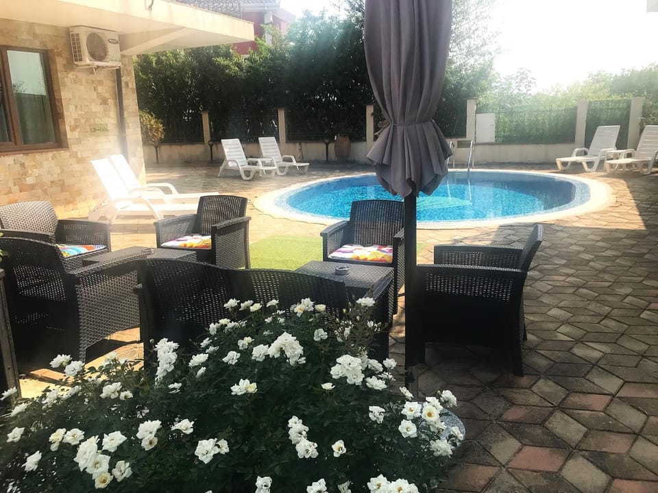 Property building, Patio, Seating area, Swimming pool