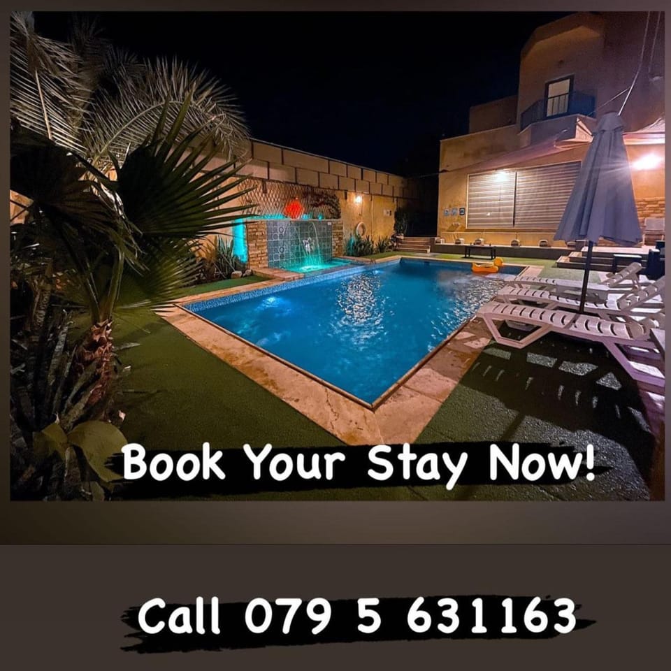 Property building, Night, Garden, Text overlay, Pool view, Swimming pool, sunbed