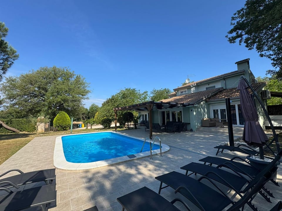 Property building, Patio, Pool view, Swimming pool, sunbed