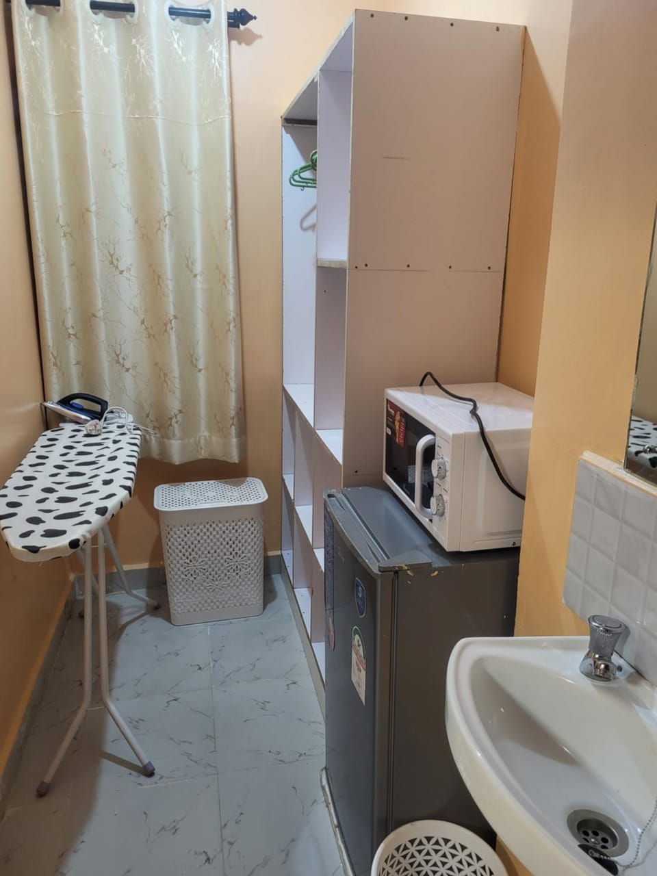 flat iron, microwave, wardrobe