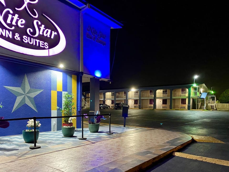 Property building, Facade/entrance, Night, Property logo or sign, Balcony/Terrace