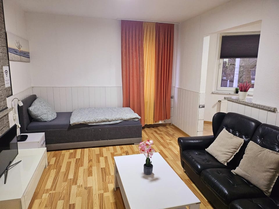 Bed, TV and multimedia, Living room, Seating area, Bedroom