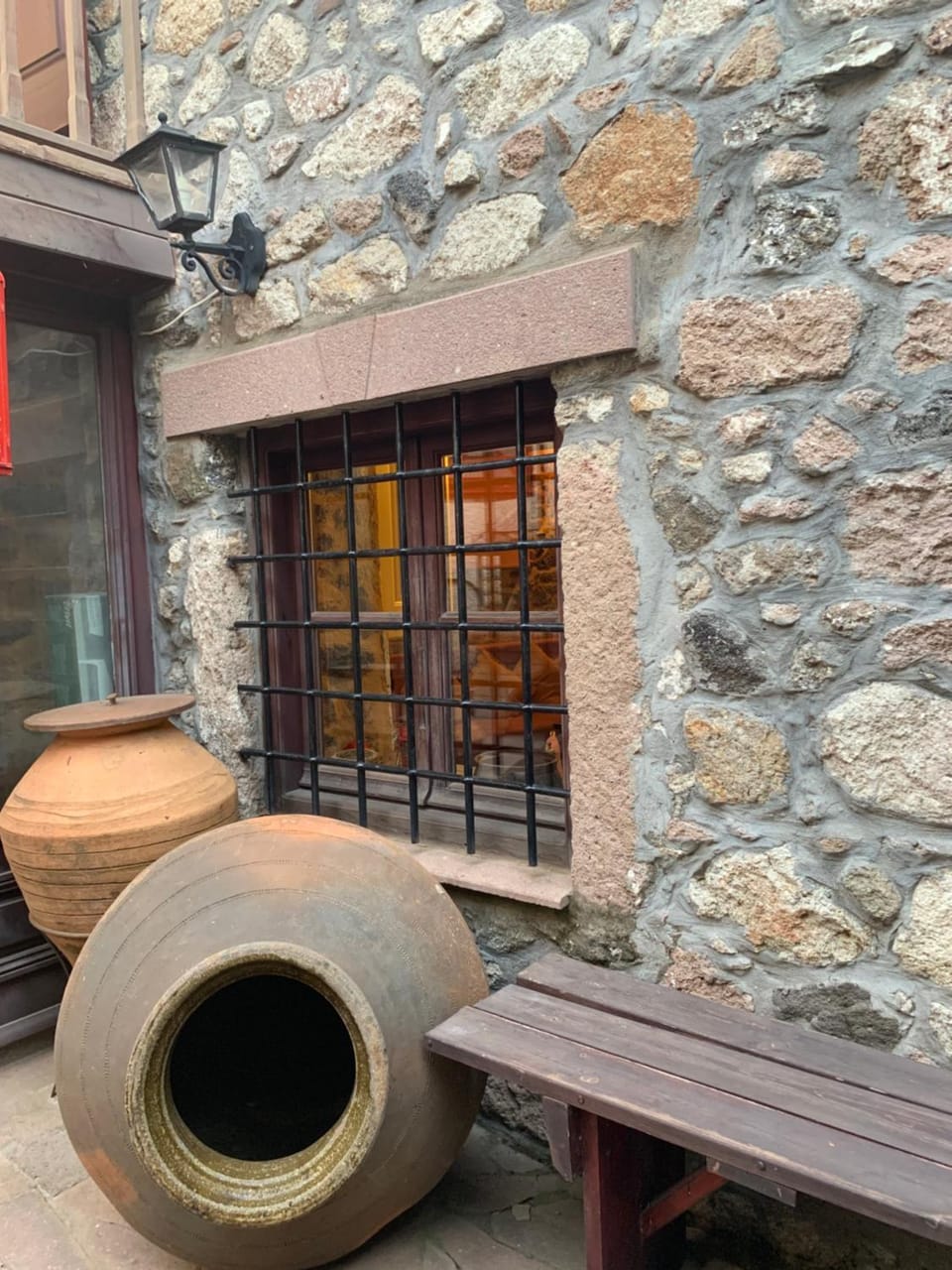 wood and stone in the path of lava House in Decentralized Administration of the Aegean