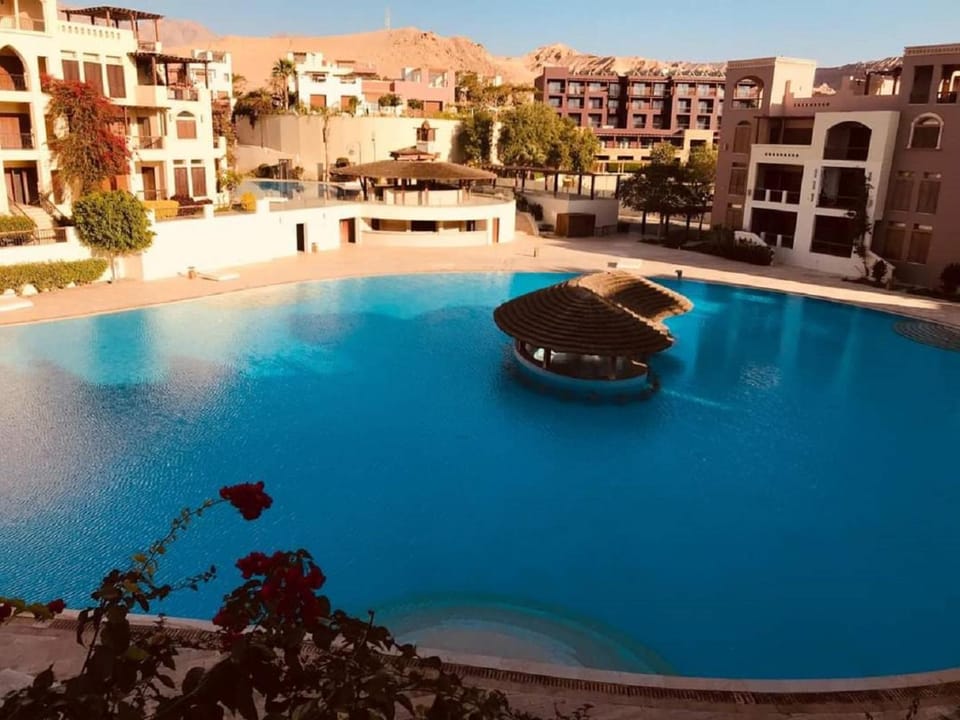 Property building, Natural landscape, Pool view, Swimming pool, sunbed