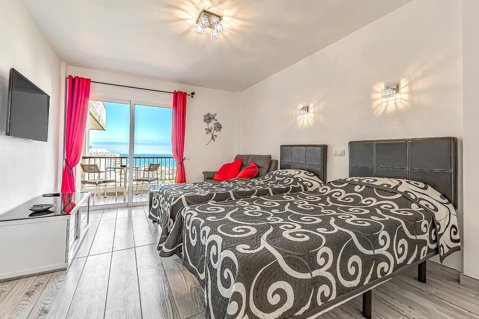 Bed, TV and multimedia, Living room, Seating area, Bedroom