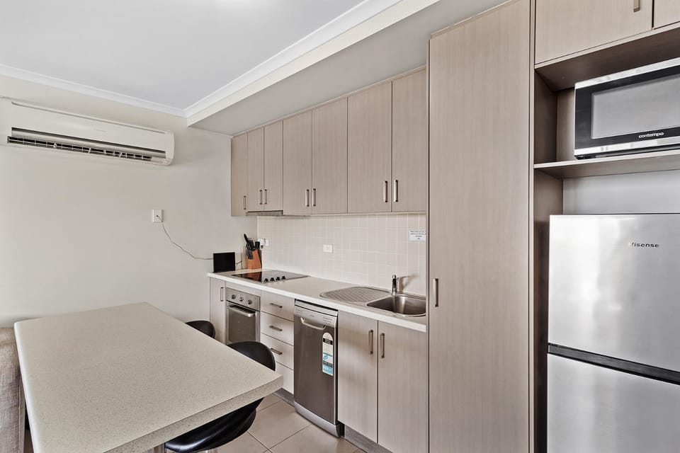 Kitchen or kitchenette, dishwasher, oven, air conditioner