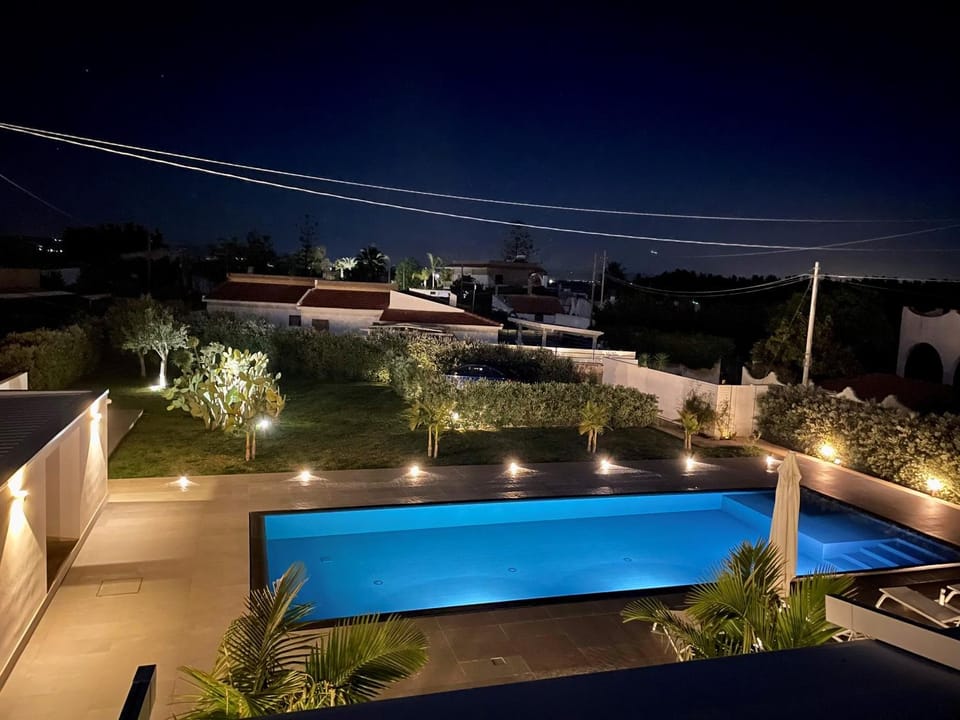 Property building, Night, Solarium, Balcony/Terrace, Balcony/Terrace, Garden view, Garden view, Pool view, Swimming pool, sunbed