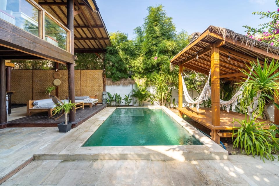 Property building, Patio, Day, Natural landscape, Garden, Garden view, Pool view, Swimming pool, sunbed, towels