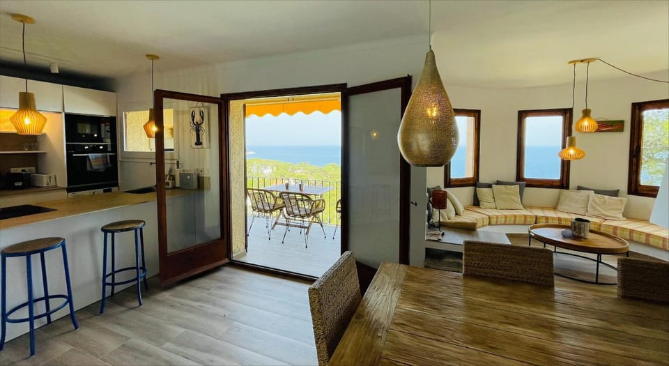 Kitchen or kitchenette, Living room, Seating area, Dining area, Sea view