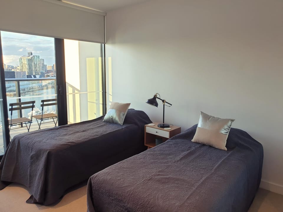 Orange Stay at Collins Wharf Apartment in Melbourne
