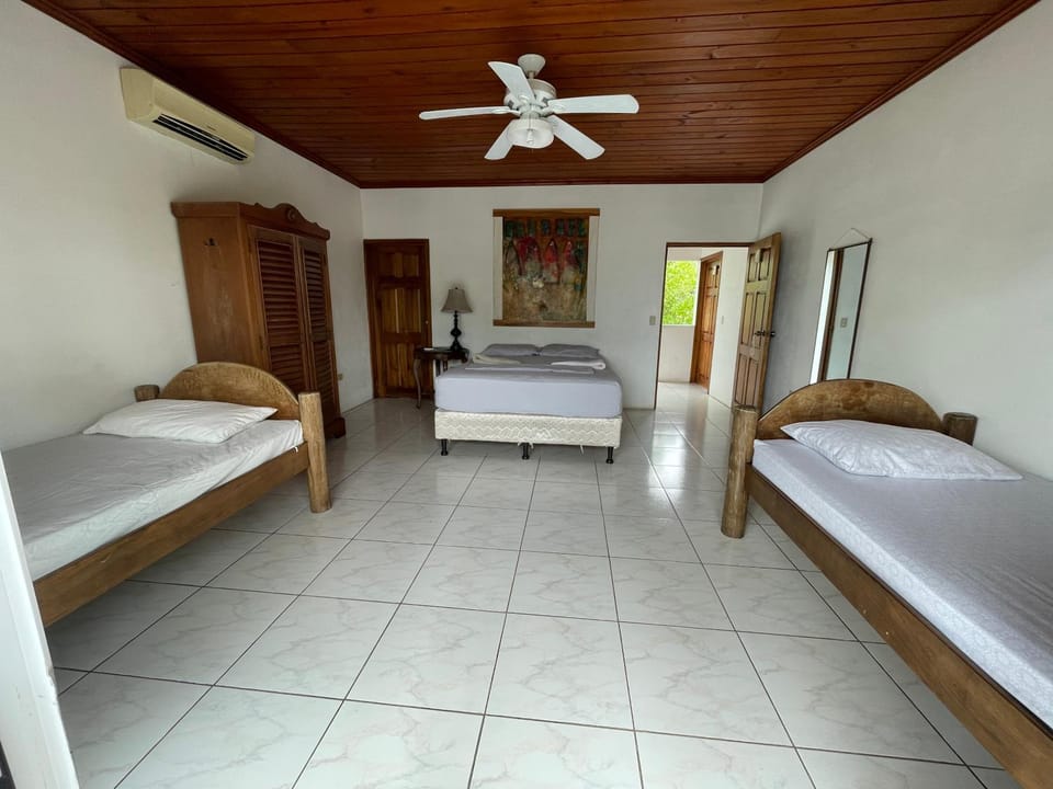 Photo of the whole room, fireplace, towels, air conditioner
