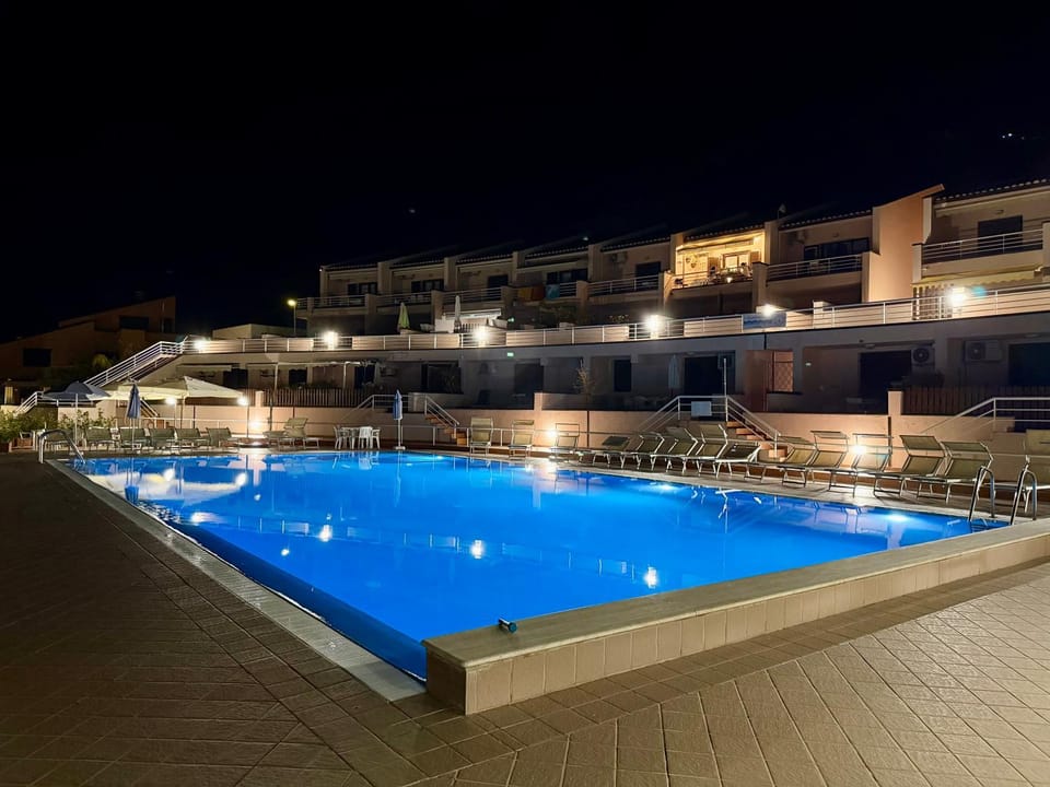 Property building, Night, Pool view, Swimming pool, sunbed