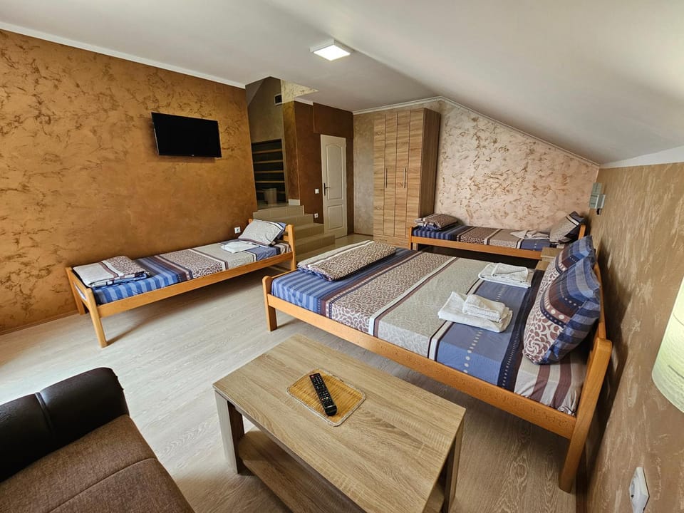 Bed, TV and multimedia, Living room, Seating area, Bedroom, wardrobe