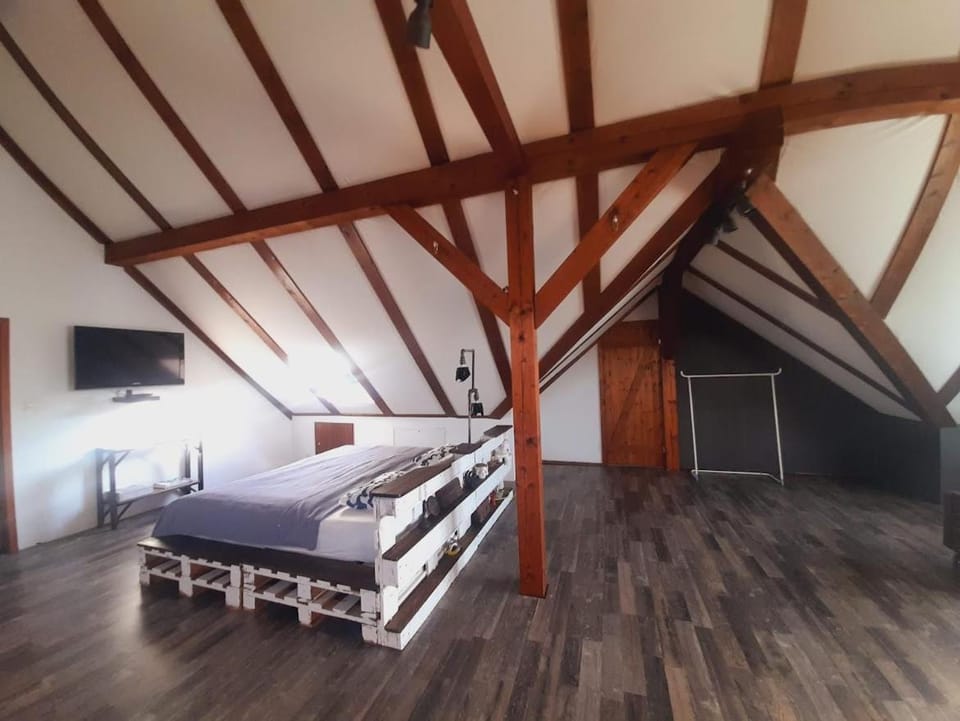 Bed, Living room, Seating area, Bedroom