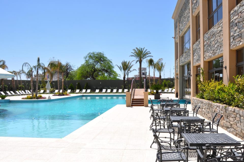 Property building, Patio, Spring, Off site, Day, Summer, Solarium, Pool view, Swimming pool, Swimming pool, sunbed