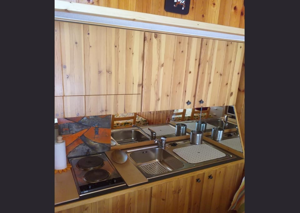 Kitchen or kitchenette, stove, kitchen