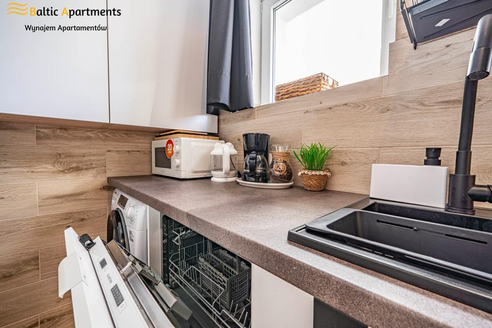 Kitchen or kitchenette, dishwasher, stove, toaster, washing machine