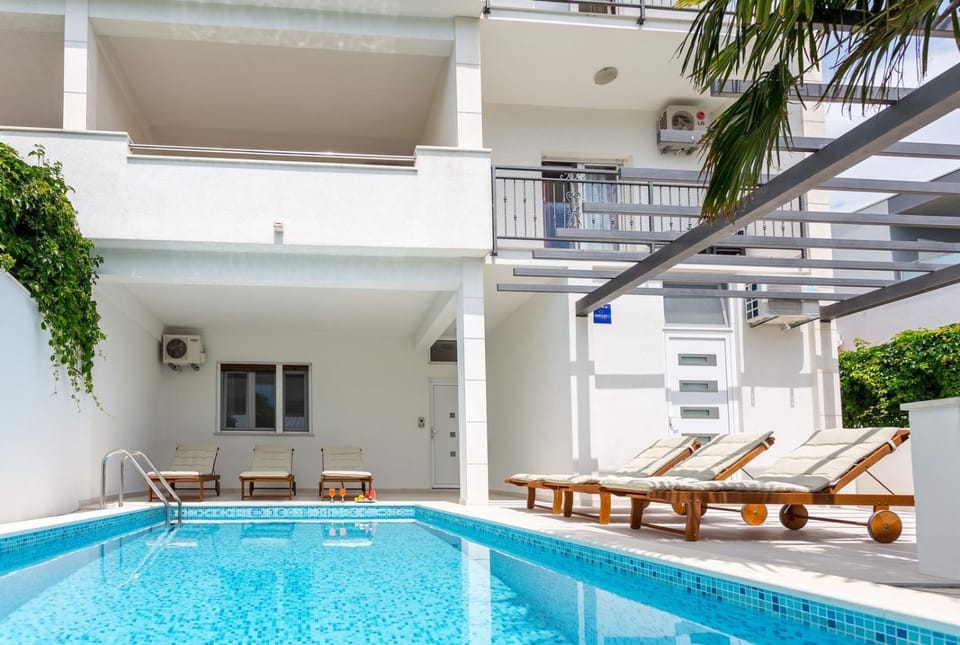 Property building, Seating area, Swimming pool