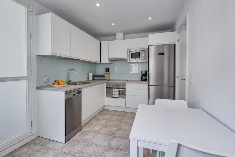 Kitchen or kitchenette, dishwasher, oven, stove, toaster