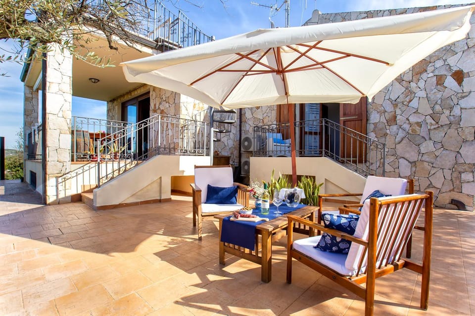 Property building, Patio, Day, View (from property/room), Living room, Seating area, Dining area
