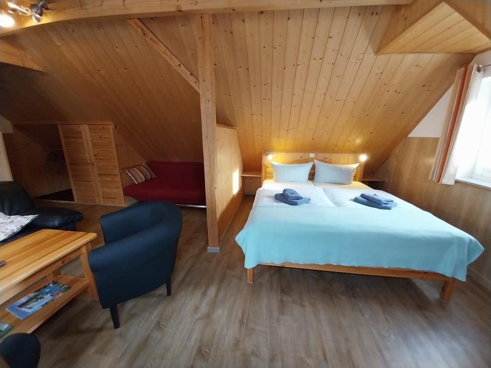 Bed, Living room, Seating area, Bedroom