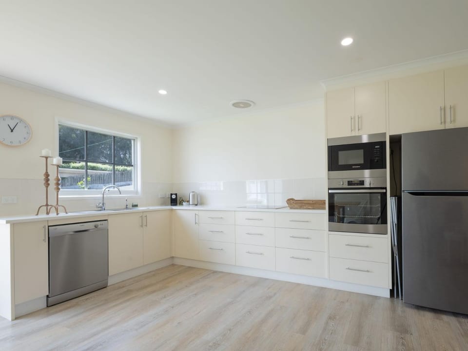 Kitchen or kitchenette, dishwasher, oven, stove