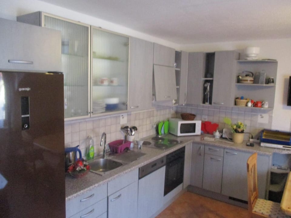 Kitchen or kitchenette, dishwasher, oven, stove