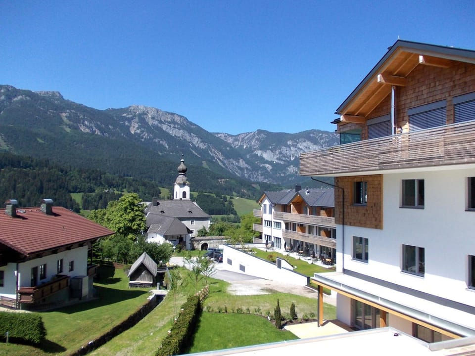Property building, Nearby landmark, Facade/entrance, Day, Neighbourhood, Natural landscape, Summer, On site, City view, Garden view, Mountain view