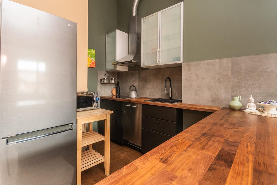 Kitchen or kitchenette, dishwasher, oven, stove