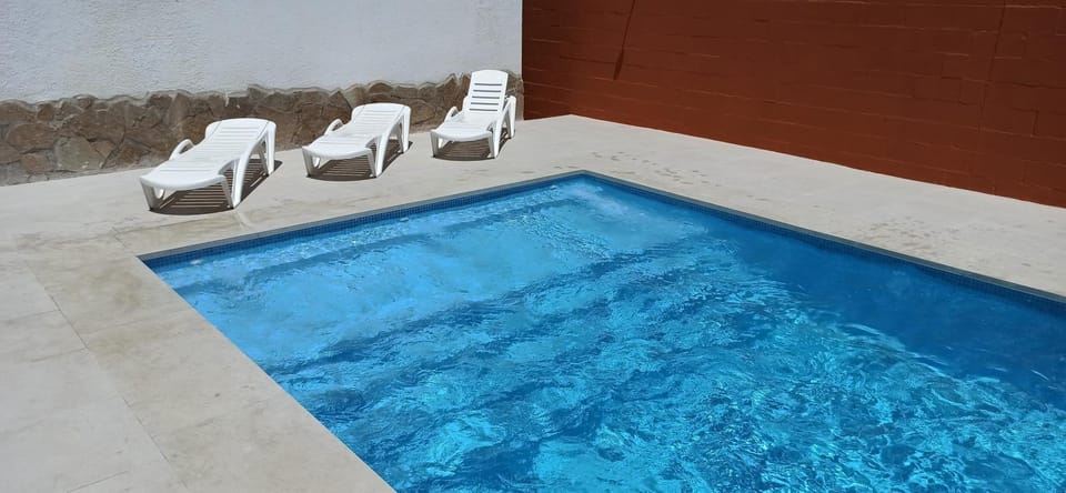 Property building, Living room, Swimming pool