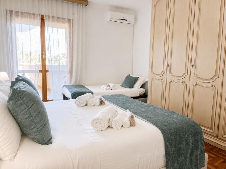 Bed, Photo of the whole room, Bedroom, towels, air conditioner