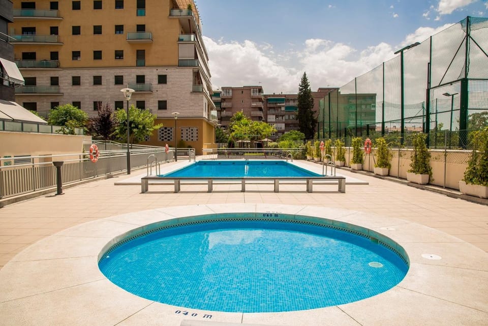 EnjoyGranada LUJO Piscina y Parking Apartment in Granada