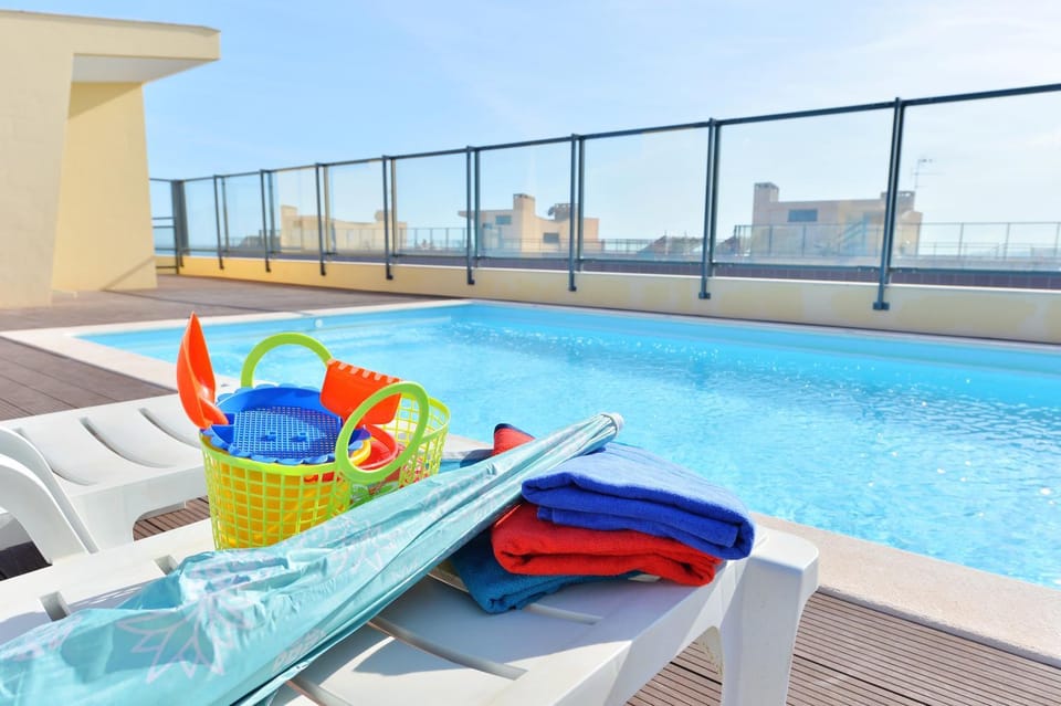 Pool view, sunbed, towels
