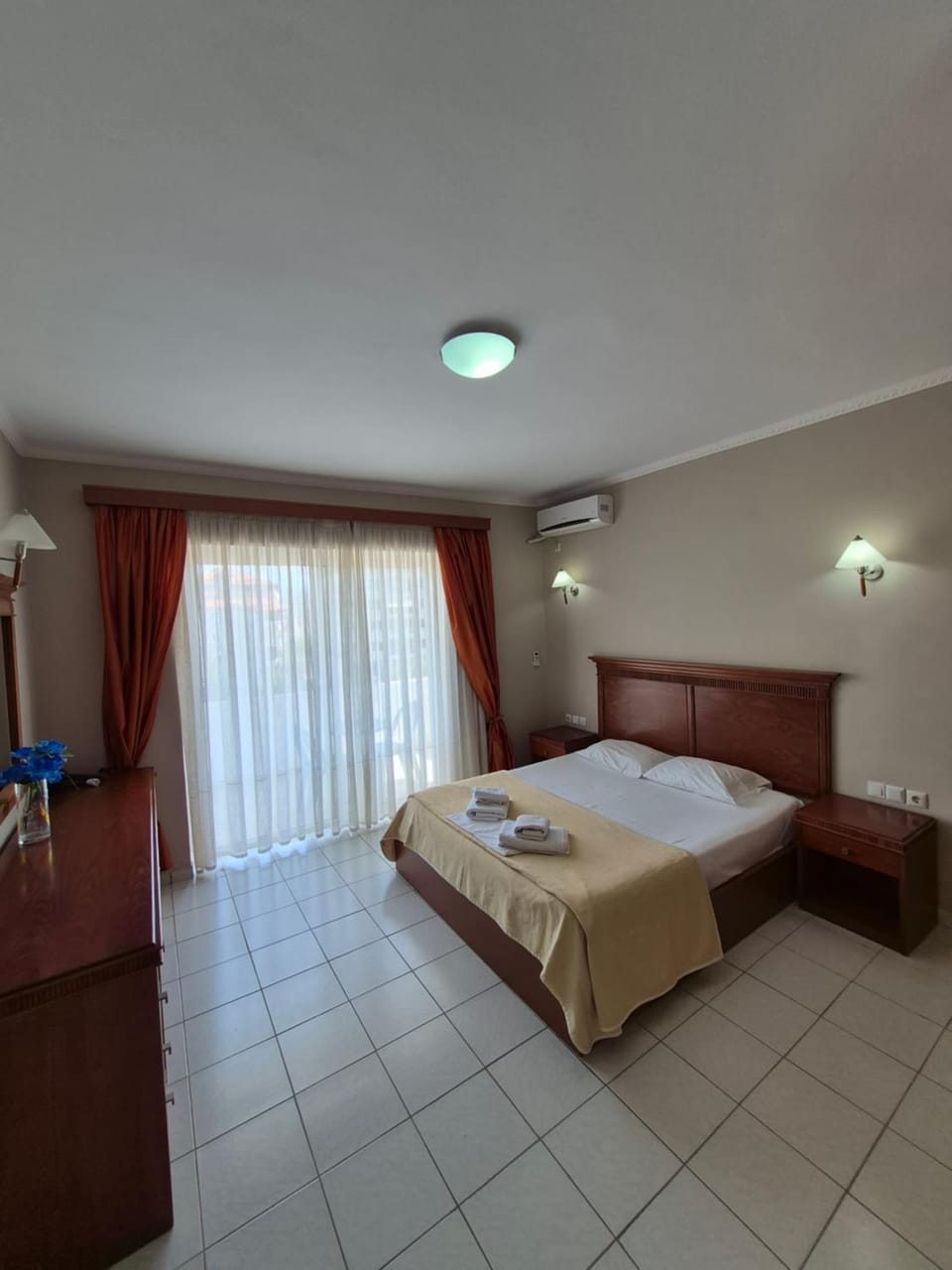 Bed, Photo of the whole room, Bedroom, hair dryier, towels, air conditioner