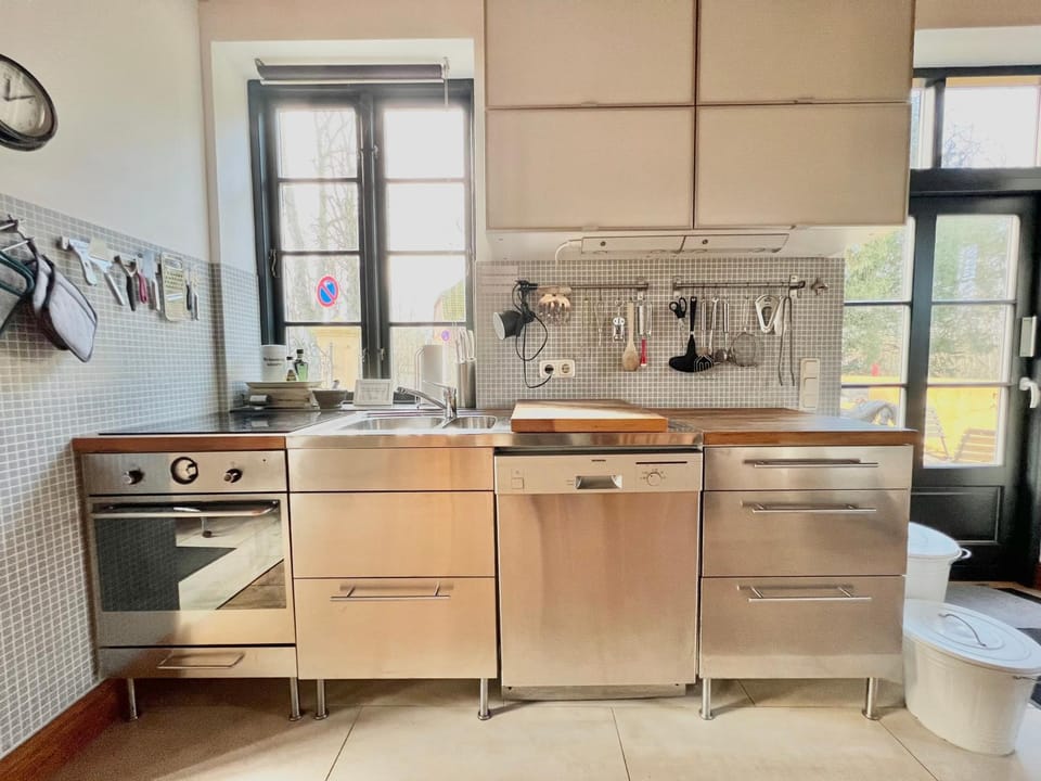 Kitchen or kitchenette, dishwasher, oven, stove