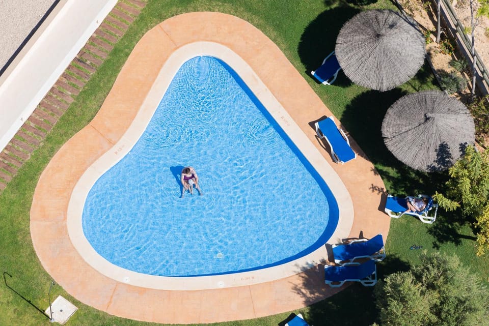 Property building, People, Solarium, Pool view, Swimming pool