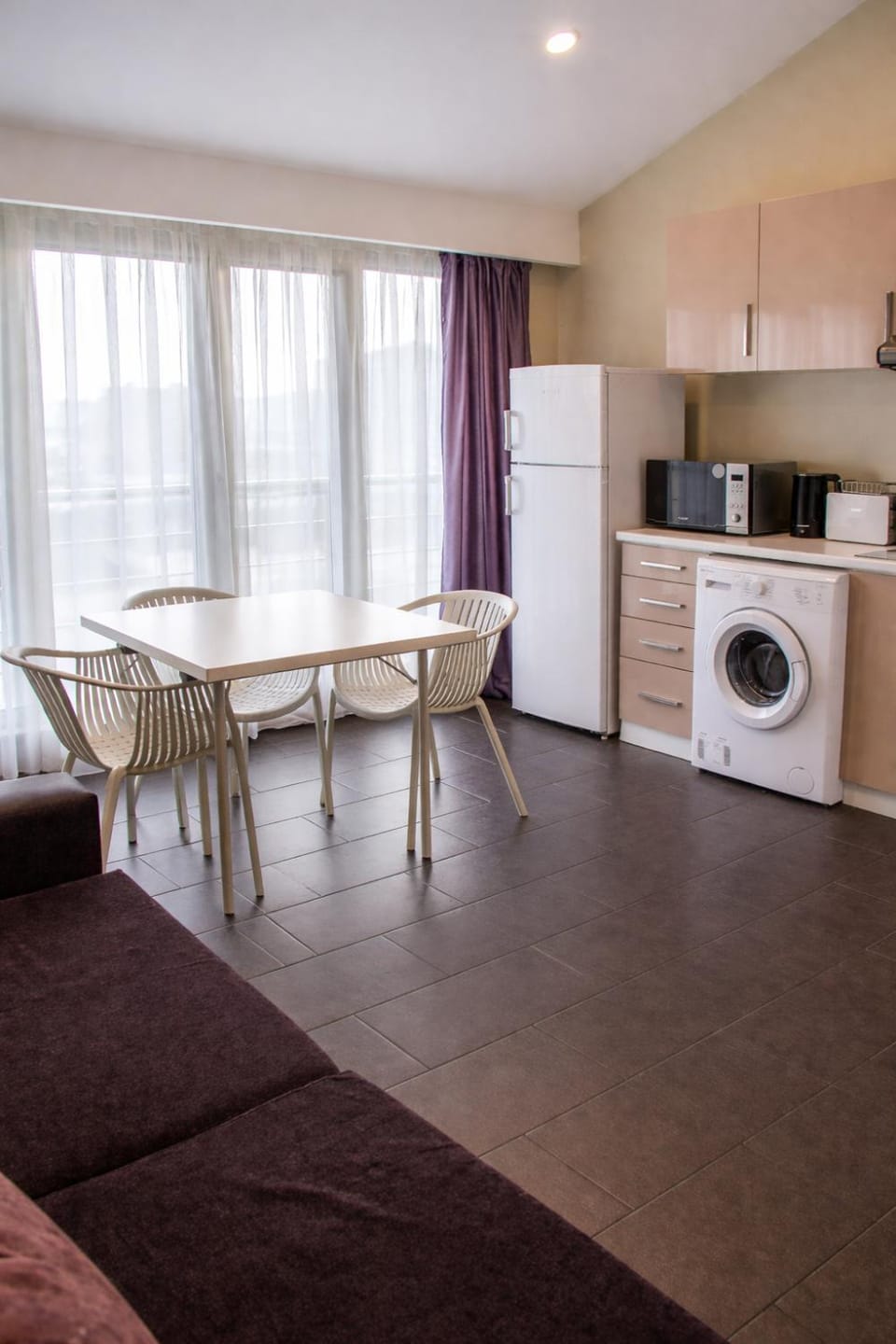 Kitchen or kitchenette, microwave, stove, toaster, washing machine, kitchen