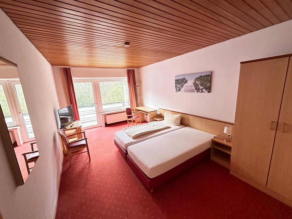 Bed, TV and multimedia, Living room, Photo of the whole room, Seating area, Bedroom, hair dresser, wardrobe