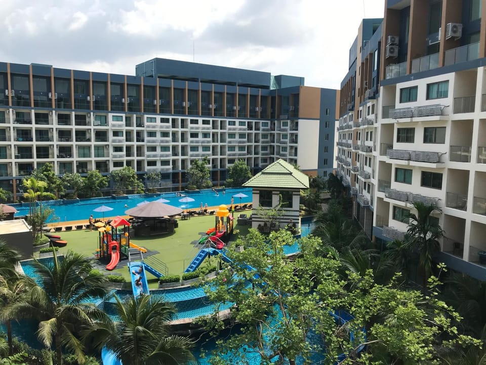Property building, Facade/entrance, Day, Children play ground, Pool view, Swimming pool, sunbed