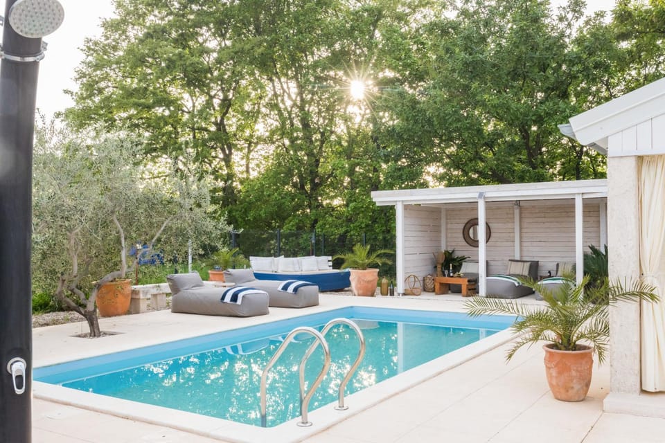 Patio, Day, Natural landscape, Pool view, Swimming pool, sunbed